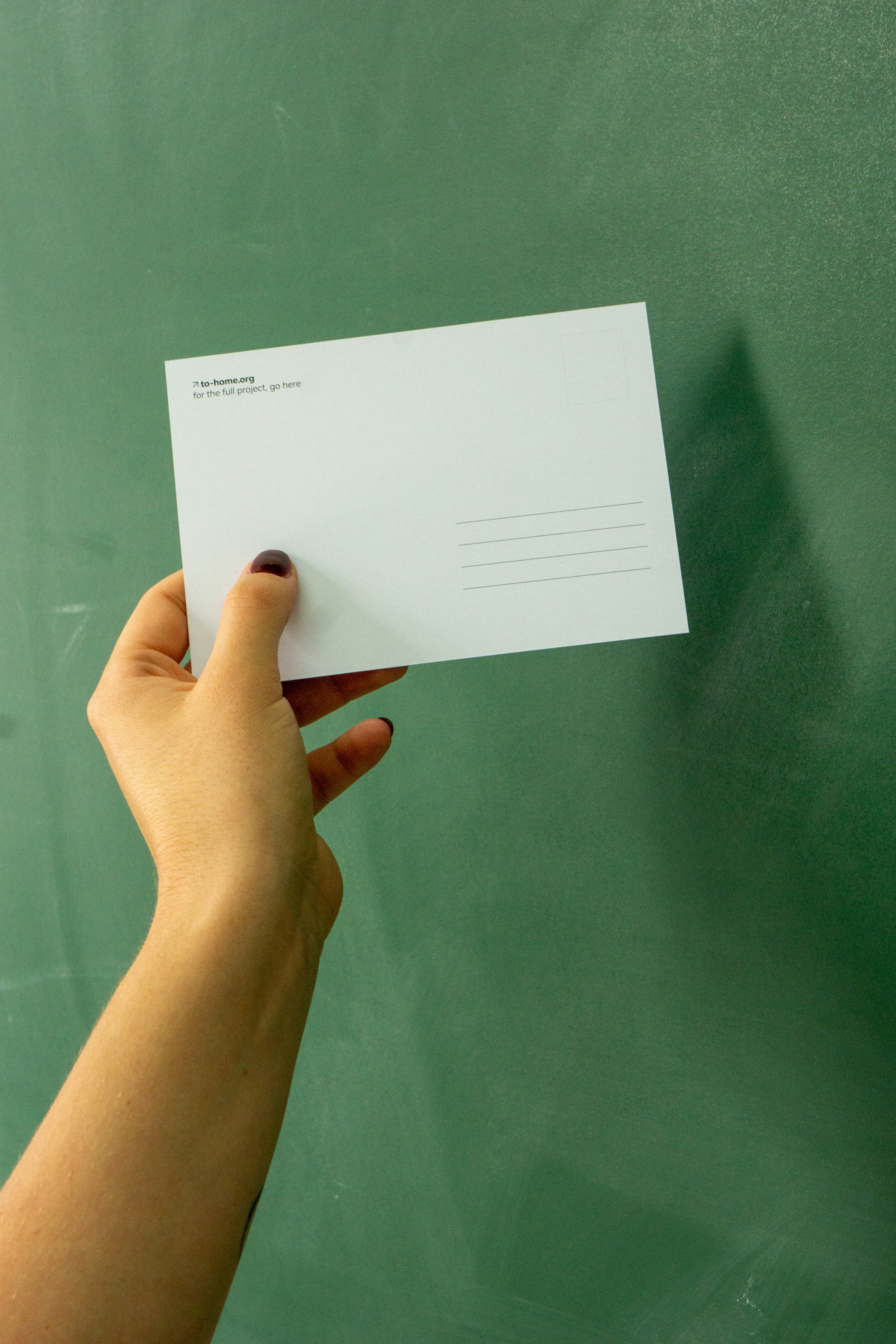 Hands with envelope — to home correspondence