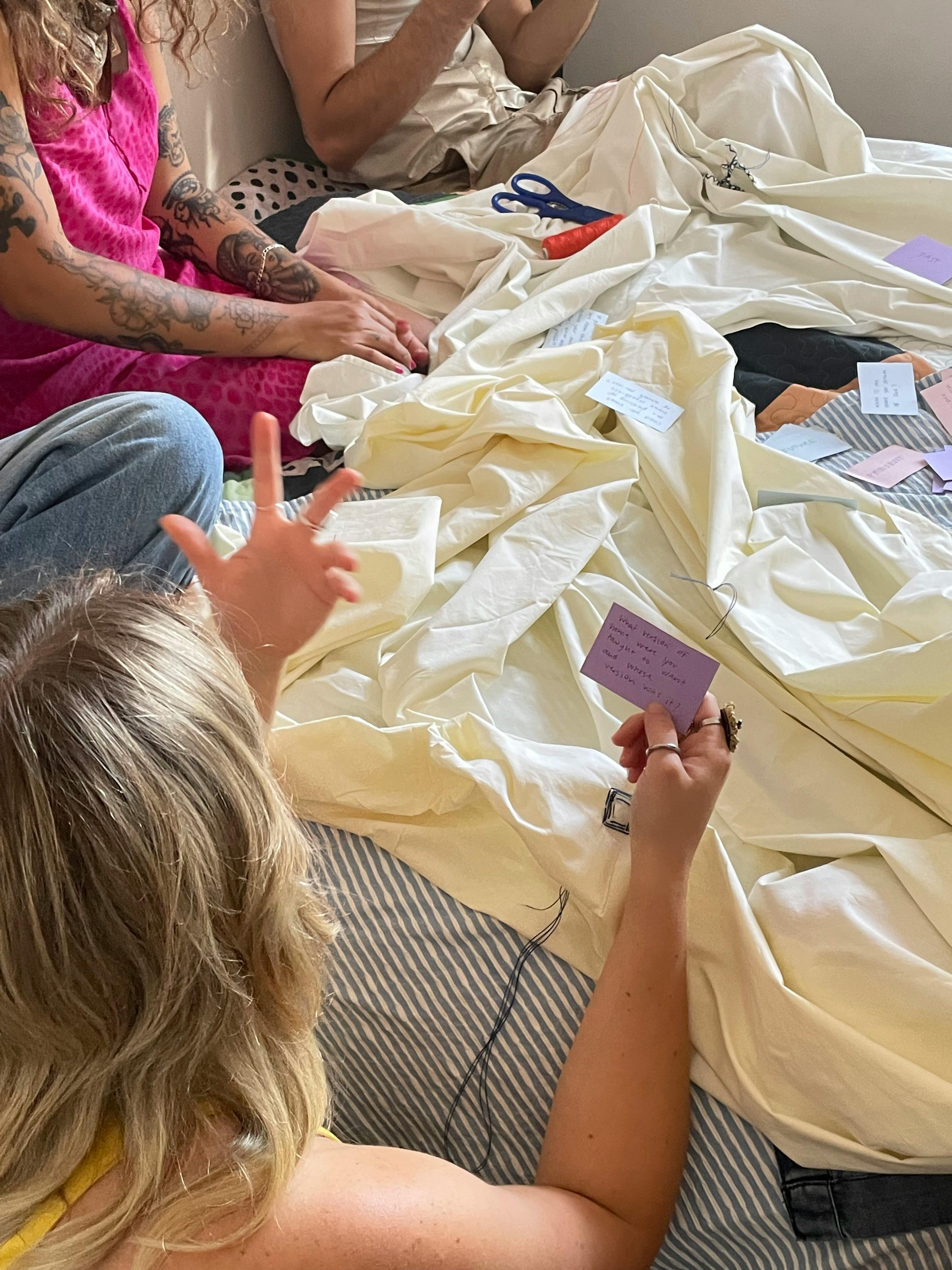 An initial workshop testing the hypothesis and question cards, embroidering bedsheets.